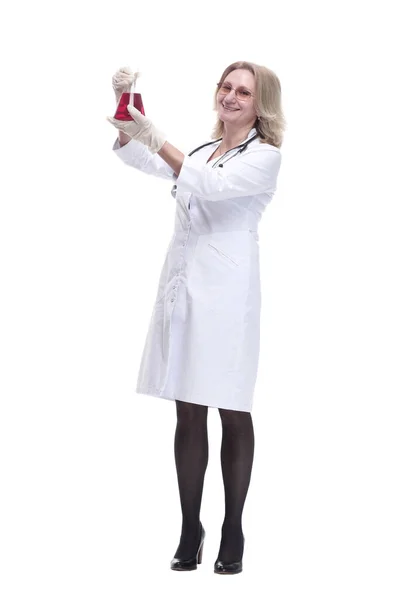 Medical woman looking at the liquid in a laboratory flask. — Stock Photo, Image