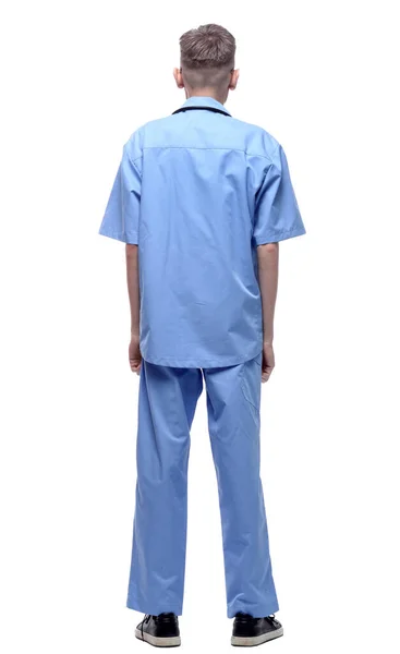 Bakifrån. Sjukvårdare i blå uniform läser en annons på en vit skärm. — Stockfoto