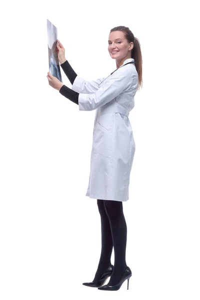 Side view. smiling woman doctor looking at an x-ray. — Stock Photo, Image