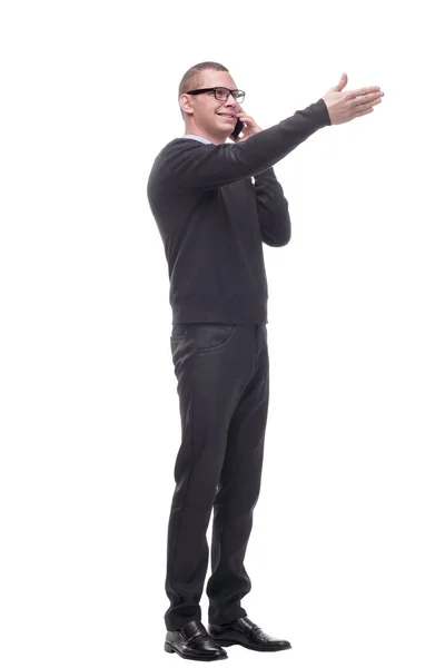 Young adult man talking on the phone pointing with finger to the camera and to you Stock Picture