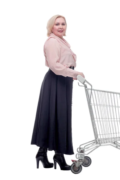 Happy blonde woman with shopping cart trolley in sale season — Stock Photo, Image