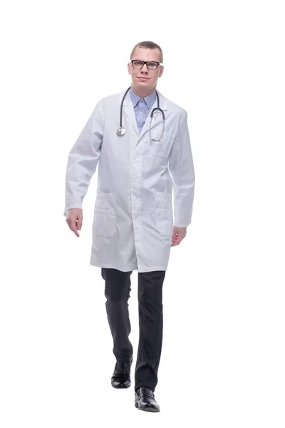 Full length profile shot of a doctor with a stethoscope walking isolated on white background — Stock Photo, Image