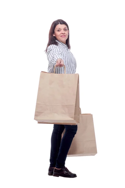 Full length side view of young businesswoman holding shopping bags — Stock Photo, Image