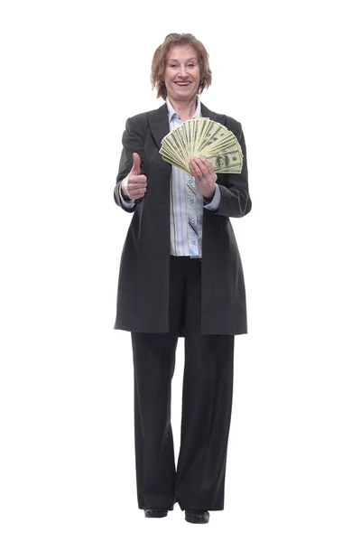 Front view of senior brunette businesswoman in black suit holding money — Stock Photo, Image