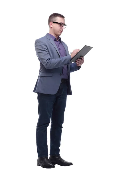 Handsome happy businessman or banker taking notes on clipboard as paperwork Royalty Free Stock Photos