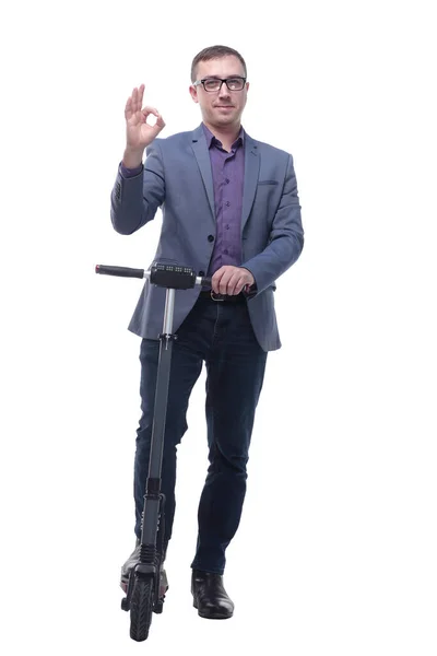 Full length portrait of an young businessman riding a scooter and showing ok — Stock Photo, Image