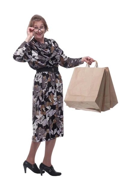 シニア女性のショッピングには、バッグの一握りを保持中毒. — ストック写真