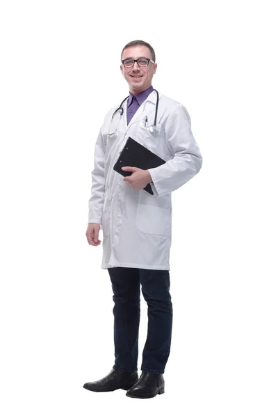 Full length portrait of a medical doctor wearing glasses and holding a clipboard — Stock Photo, Image