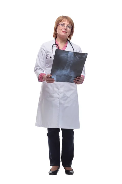 Front view of female doctor wearing stethoscope and glasses looking at an x-ray — Stock Photo, Image