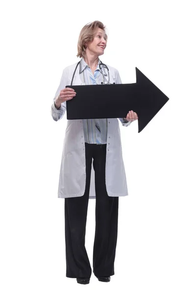 Friendly senior medical doctor pointing direction with arrow — Stock Photo, Image