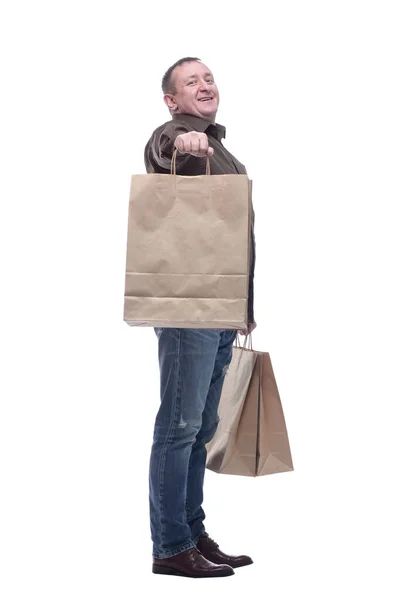 Side view. happy adult man with shopping bags . — Stock Photo, Image