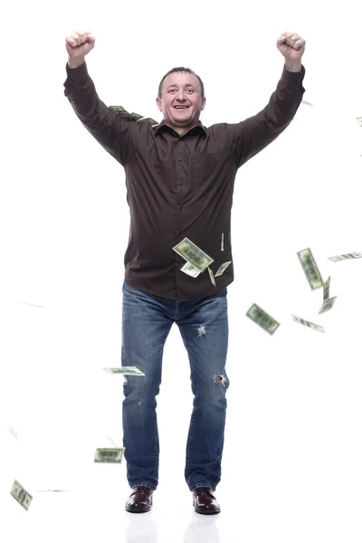 In full growth. happy man standing in the rain of money . — Stock Photo, Image