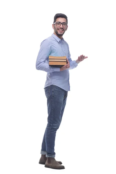 Joven casual con una pila de libros. — Foto de Stock