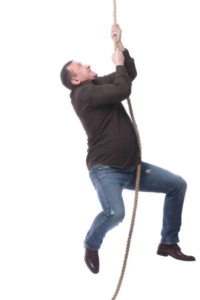 En målmedveten man som klättrar i repet. isolerad på en vit bakgrund. — Stockfoto