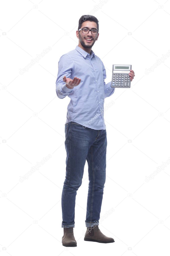 in full growth. smart young man with a calculator .