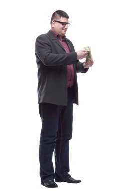 Bir tomar banknotu olan olgun bir iş adamı..