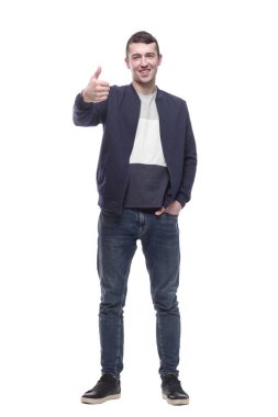 Kot pantolonlu çekici genç adam başparmağını kaldırıyor..