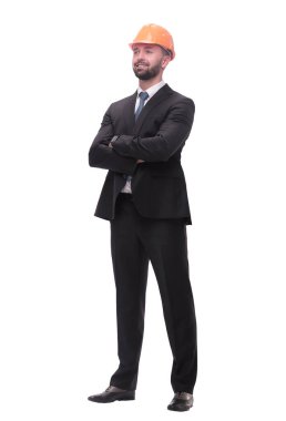 Yan görünüm. Miğferli işadamı kopyalama alanına bakıyor..