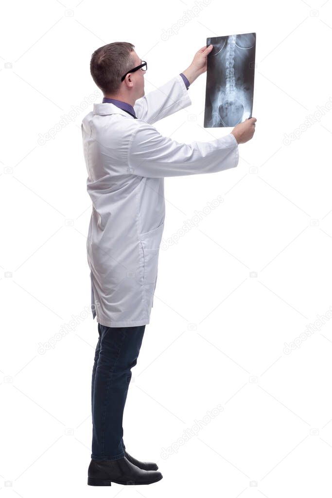 Side view of medical doctor looking at a x-ray image