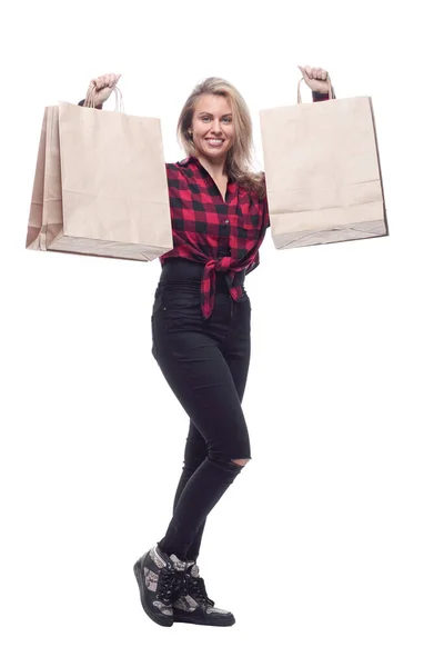 Casual young woman with shopping bags striding forward . — Stock Photo, Image