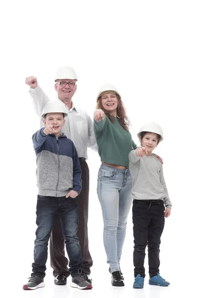 En pleno crecimiento. familia feliz en cascos protectores. —  Fotos de Stock