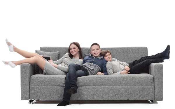 Mom and her two sons relax sitting on the couch. — Stock Photo, Image