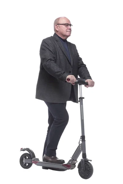 Side view . Mature man with electric scooter looking forward — Stock Photo, Image