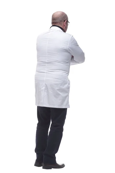 Οπίσθια όψη. γιατρός-θεραπευτής διαβάζοντας μια διαφήμιση σε μια λευκή οθόνη. — Φωτογραφία Αρχείου