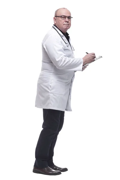 In full growth. a serious doctor writing a prescription — Stock Photo, Image