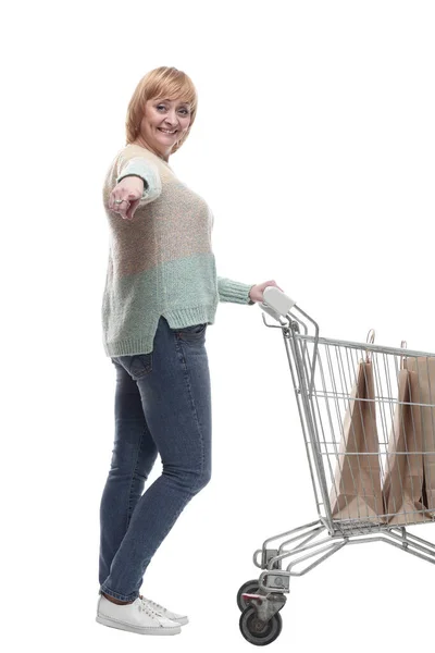 In full growth. attractive casual woman with shopping cart . — Stock Photo, Image