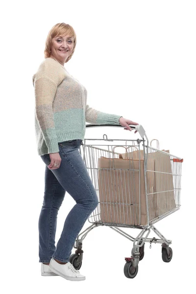 In full growth. attractive casual woman with shopping cart . — Stock Photo, Image