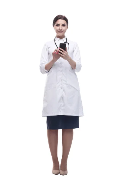 In full growth. female doctor with a smartphone. — Stock Photo, Image