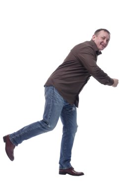 Yan görünüş. Gülümseyen olgun adam acelesi olan bir yerde. .