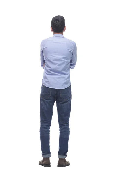 Rear view . a young man in jeans looking at a white screen. — Stock Photo, Image