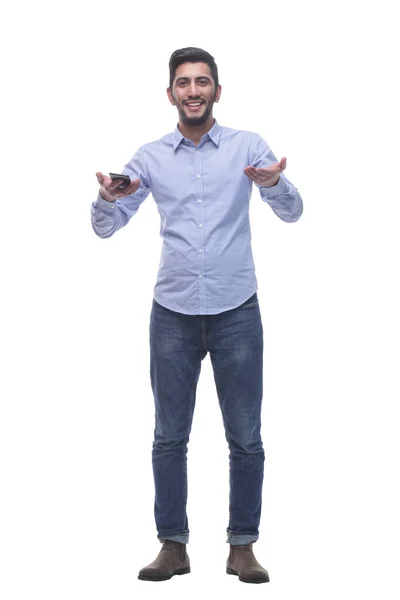 Friendly man with a smartphone looking at you . — Stock Photo, Image