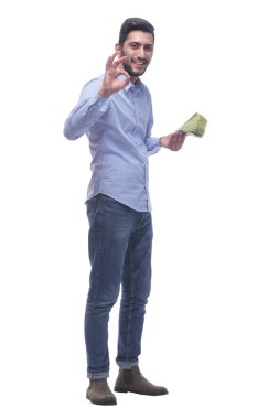 Dolarlık banknotları olan mutlu bir genç adam. .