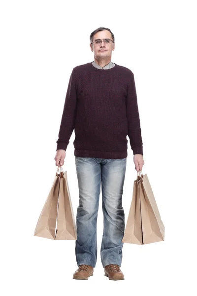 In voller Länge. lässiger Mann mit Einkaufstaschen. isoliert auf einem weißen — Stockfoto