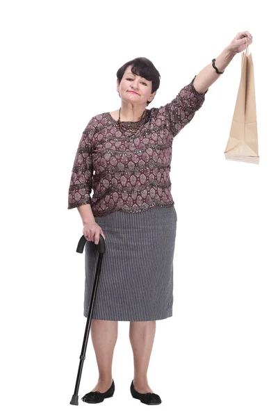 지팡이 와 쇼핑백을 들고 있는 연로 한 부인. — 스톡 사진