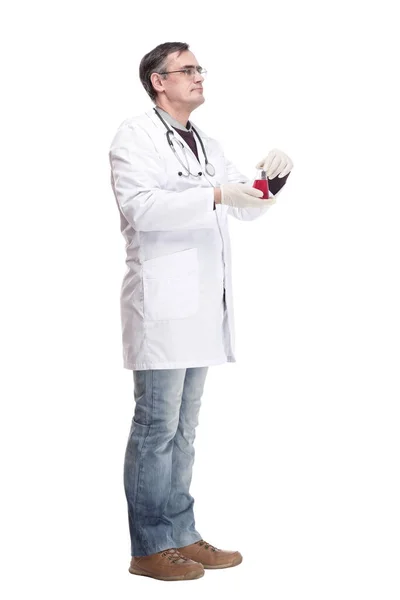 Serious doctor with a laboratory flask in his hands . — Stock Photo, Image