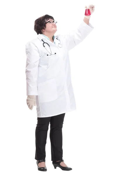 In full growth. senior female doctor with a laboratory flask . — Stock Photo, Image