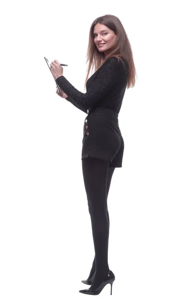 Zijaanzicht. jonge vrouw schrijft iets naar het klembord. — Stockfoto