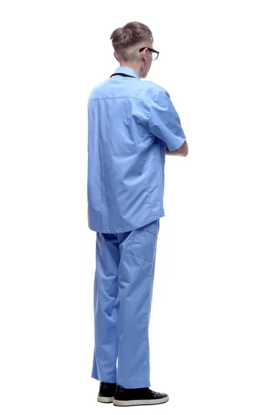 Médico de uniforme azul lendo um anúncio em uma tela branca. — Fotografia de Stock