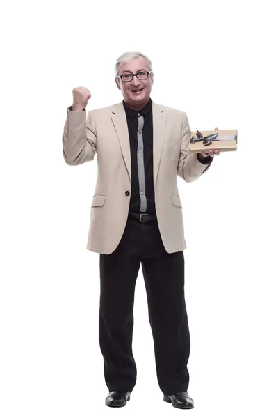 In full growth. Mature intelligent man with a gift box. — Stock Photo, Image