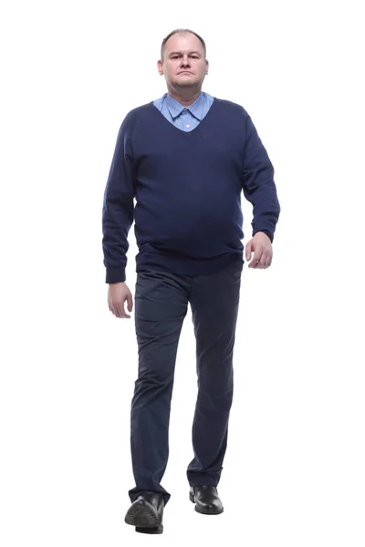 Mature man in blue jumper striding forward. — Stock Photo, Image