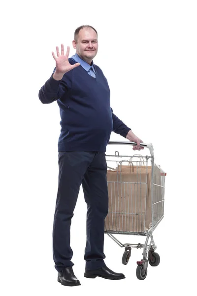 In vollem Wachstum. lässiger älterer Mann mit Einkaufswagen. — Stockfoto