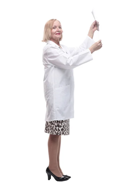 In full growth.female doctor looking at an x-ray. Royalty Free Stock Photos