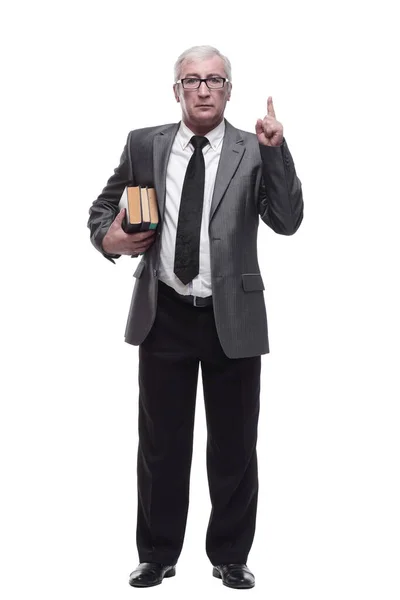 Sorridente homem de negócios com uma pilha de livros. — Fotografia de Stock