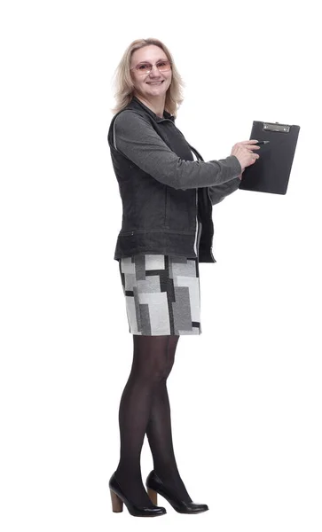 Side view. smiling woman pointing at blank clipboard — Stock Photo, Image