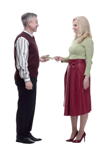 Smiling woman passing mature man banknotes. isolated on a white — Stock Photo, Image