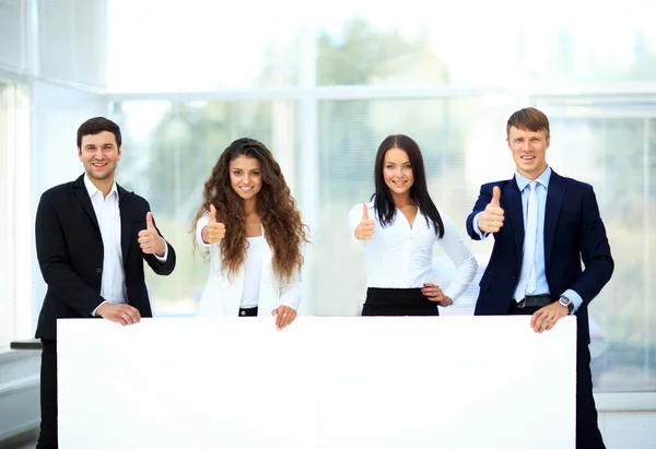 Business group with banner in office — Stock Photo, Image